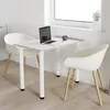 A small dining table with two chairs, a laptop, and a coffee cup, set up in a bright room near a window. Náhled obrázku produktu