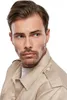 A man wearing a beige shirt. Anteprima dell’immagine prodotto