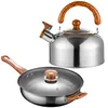 A stainless steel kettle and frying pan with wooden handles are displayed against a white background. Náhled obrázku produktu