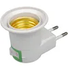 A white lamp socket adapter with a built-in switch and European-style plug prongs. Náhled obrázku produktu