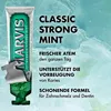 A tube of Marvis toothpaste with mint leaves and text describing its benefits. Náhled obrázku produktu