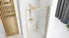 A modern bathroom with a gold-framed shower door. Produktbild-Vorschau