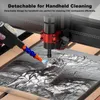 A hand holding a detachable cleaning tool connected to a CNC machine, spraying liquid onto a carved surface. Produktbild-Vorschau