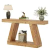 A wooden console table with decorative items on top and a basket on the shelf below, presented on a white background. Podgląd zdjęcia produktu