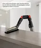A vacuum cleaner attachment with a flexible hose is shown on a countertop. Produktbild-Vorschau