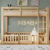 A wooden bunk bed with safety rails and a ladder, set up in a child's room with decorative lights and a teepee. Produktbild-Vorschau