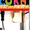 Close-up of a popcorn machine showing the top red shelf and a light bulb. Voir les images du produit