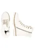 Two white lace-up boots with faux fur trim are shown against a white background. Produktbild-Vorschau