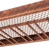 A close-up view of a metal wine rack with a copper finish. Podgląd zdjęcia produktu