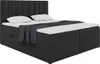 A dark grey upholstered boxspring bed with a headboard, two white pillows, and a dark grey throw blanket draped over the mattress. Produktbild-Vorschau