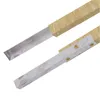 Two metal brackets with wooden handles, likely for construction or outdoor equipment. Náhľad obrázku produktu