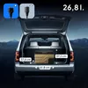A portable cooler placed in the open trunk of a car at night, with mountains and stars in the background. Dimensions are indicated on the cooler and the trunk floor. Power adapter icons are shown in the top left corner. Anteprima dell’immagine prodotto