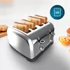 A chrome toaster with four slices of toast in it, placed on a white surface with some baked goods in the background. Produktbild-Vorschau