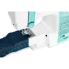 Close-up view of a sewing machine working on denim fabric. Produktbild-Vorschau