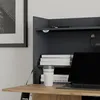 A close-up view of a desk with a laptop, books, and a coffee cup. Anteprima dell’immagine prodotto