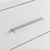 A close-up shot of a silver drawer pull on a white drawer. Podgląd zdjęcia produktu