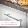 A close-up of a silver cabinet handle mounted on a white surface, with jars of food on a gray countertop in the background. Text overlays describe its suitability for kitchens and living areas. Produktbild-Vorschau