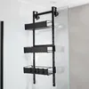 A black metal shower caddy with three baskets is hanging on a glass shower door. Anteprima dell’immagine prodotto