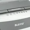 A close-up view of the top panel of a Leitz shredder, showing control buttons and branding. Náhľad obrázku produktu