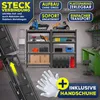 A workshop or garage setting with shelving units filled with tools and supplies, and a lawnmower. Produktbild-Vorschau