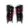 Two black and red car tail lights shown from the back against a white background. Voir les images du produit