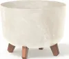 A cream-colored planter with a marbled pattern sits on three brown legs against a white background. Produktbild-Vorschau