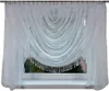 A white sheer curtain with beaded fringe is draped across a window. Produktbild-Vorschau