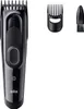 A black Braun hair clipper with accessories on a white background. Podgląd zdjęcia produktu