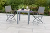 A patio set with two chairs and a table in a garden setting. Produktbild-Vorschau