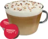 A Starbucks Toffee Nut Latte in a clear mug with two Starbucks Toffee Nut Latte pods in front of it. Produktbild-Vorschau