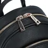 A close-up view of the zippers on a black backpack. Náhľad obrázku produktu