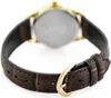 A close-up view of the back of a watch with a brown leather strap and a gold buckle. Produktbild-Vorschau