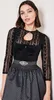 A woman is wearing a black dirndl top and skirt. Produktbild-Vorschau