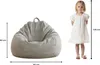 A child is shown next to a beanbag chair to illustrate its size. Anteprima dell’immagine prodotto