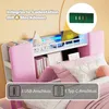 A close-up view of a bed headboard with integrated storage and lighting, featuring charging ports. Produktbild-Vorschau