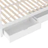 A close-up view of the bottom section of a white bed frame, showing two drawers underneath. The wooden slats of the bed base are visible above the drawers. Anteprima dell’immagine prodotto