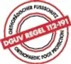A circular stamp with text and a red diagonal band. Voir les images du produit