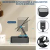 A black phone stand with adjustable angles is shown on a shelf, with close-up views of its features on the right side. Produktbild-Vorschau