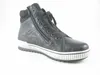 A black high-top sneaker is shown against a white background. Voir les images du produit