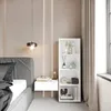 A bedroom scene with a white bookshelf next to a bed. Produktbild-Vorschau