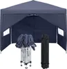A dark gray pop-up canopy tent is shown fully assembled and open, with its folded frame and carrying bag placed in front of it. The tent has windows on its side panels. Voir les images du produit