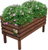 A wooden planter box filled with pink flowers and green foliage, set against a white background. Anteprima dell’immagine prodotto