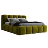 A green upholstered bed with a headboard and footboard, shown from a side angle against a white background. Produktbild-Vorschau