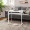 A white folding desk is placed in front of a gray sofa in a living room setting. Produktbild-Vorschau