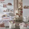 A child's bedroom decorated with a rainbow and cloud theme. Podgląd zdjęcia produktu