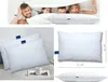 A collage of images showing a family playing under a blanket with pillows, and close-ups of pillows with dimensions. Produktbild-Vorschau