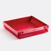 A red baking pan with pink trim is shown against a white background. Produktbild-Vorschau