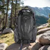 A backpack is placed on rocks in a forest with mountains in the background. Náhľad obrázku produktu