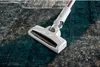 A white cordless vacuum cleaner head is shown on a textured rug. Anteprima dell’immagine prodotto