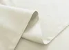 A close-up view of a folded beige fabric, likely a curtain or textile. Produktbild-Vorschau